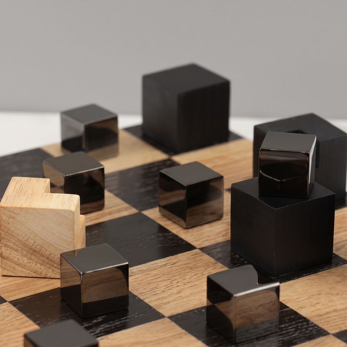 Light and dark hardwood chess pieces detail