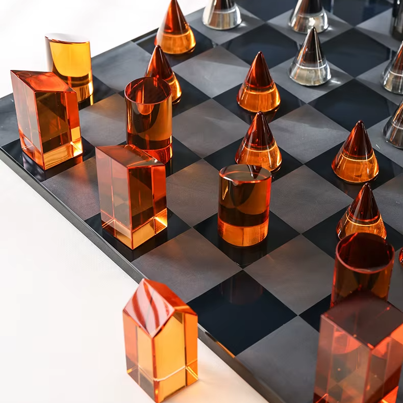Amber and smoked grey crystal chess pieces